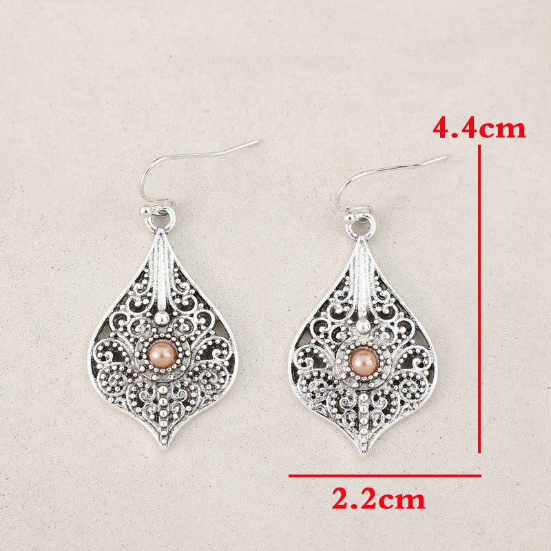 Wholesale Bohemian Retro Style Teardrop-shaped Hollow Pattern Inlaid Gem Alloy Earrings